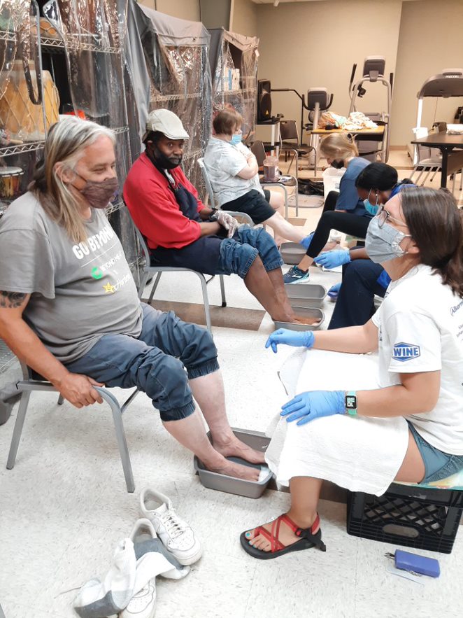 Volunteers from Vanderbilt Psychiatric Hospital provide a foot clinic to members. 